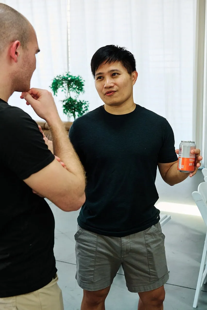 Dennis chatting with another attendee at the OpenClaw LA meetup